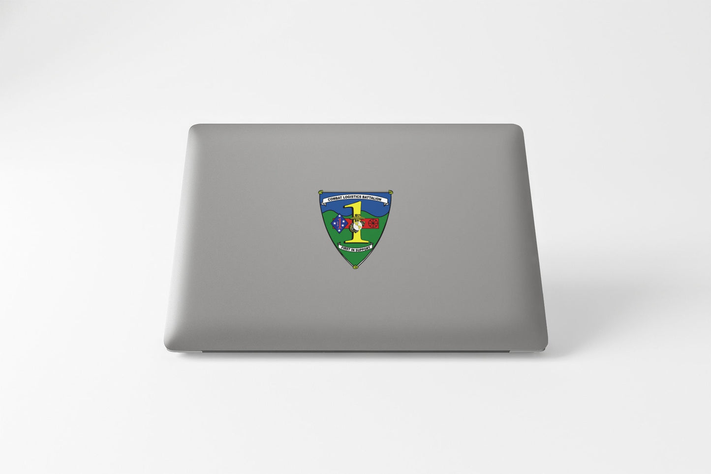 a laptop computer with a crest on it