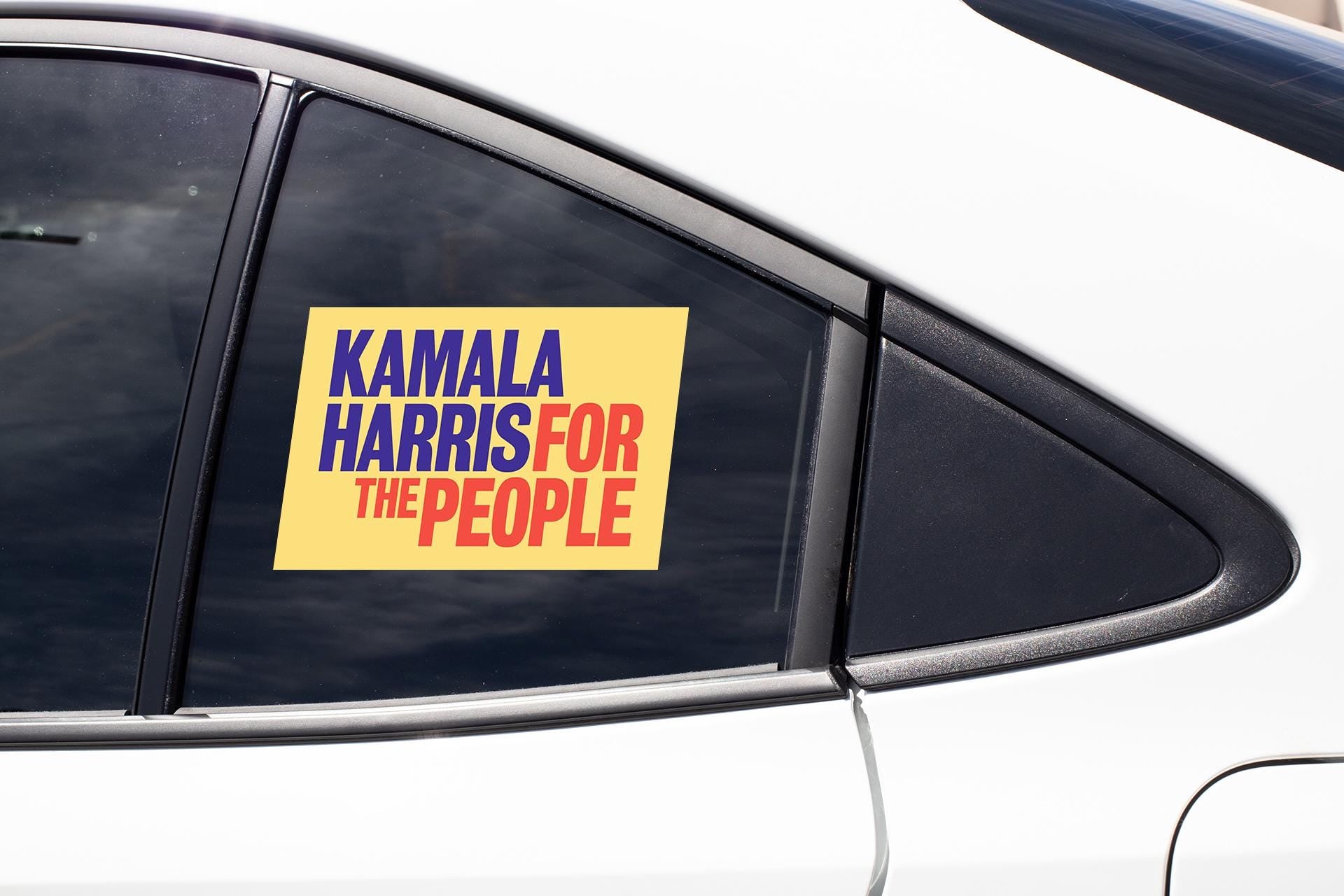 a sticker on the side of a car that says karma harris for the people