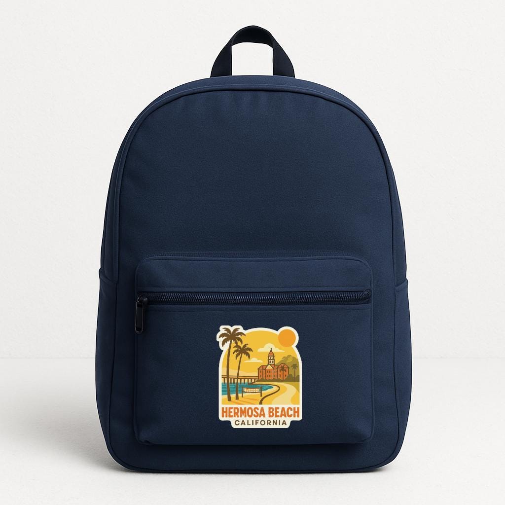 A navy blue backpack with a sticker on the front that says "HERNOSA BEACH, CALIFORNIA".