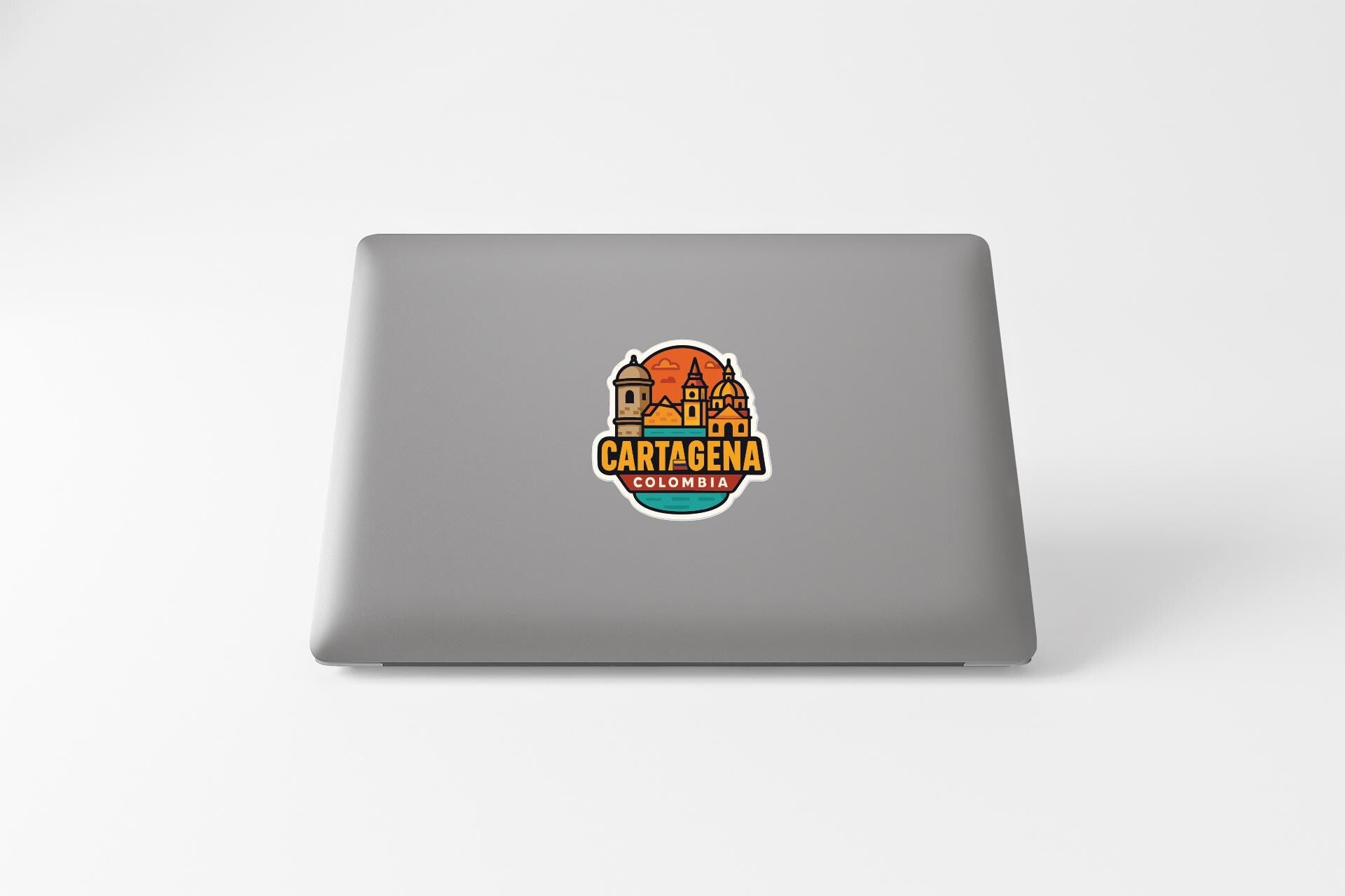A sticker on the back of a laptop displaying the text "CARTAGENA COLOMBIA" along with an illustration of a city skyline.