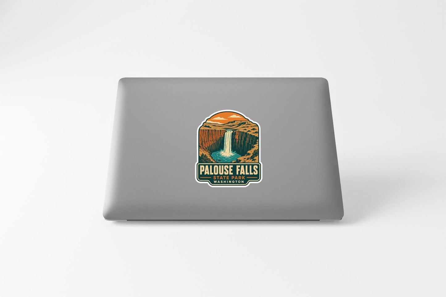 a sticker on the back of a laptop that displays the name "Palouse Falls" and the location "Washington".