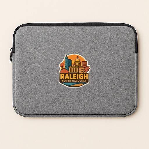 A gray laptop sleeve with a graphic of the Raleigh, North Carolina skyline.