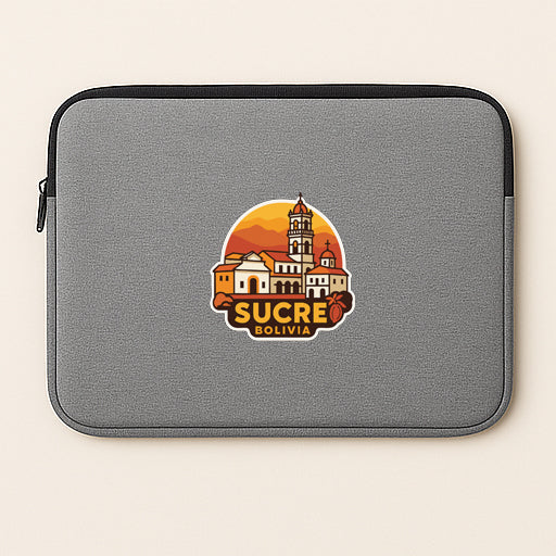 a gray laptop sleeve with a graphic of a cityscape and the text "Sucre Bolivia" printed on it.