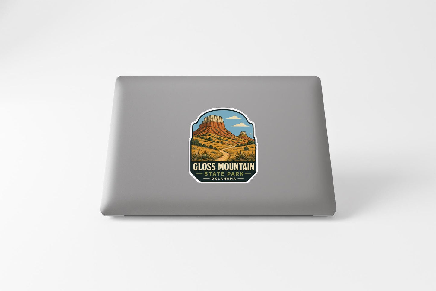 A sticker featuring a mountain landscape with a trail leading to the peak of the mountain.