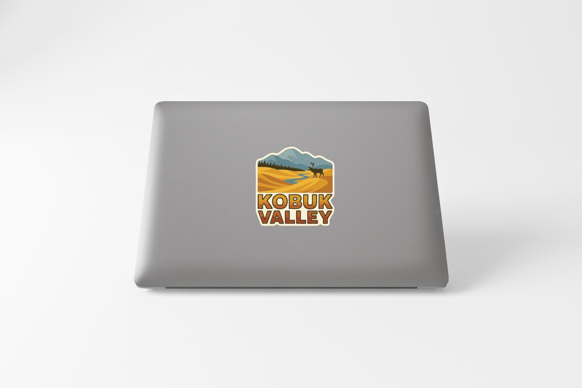 a sticker with a landscape and mountains, along with the text "KOBUK VALLEY" printed on it.