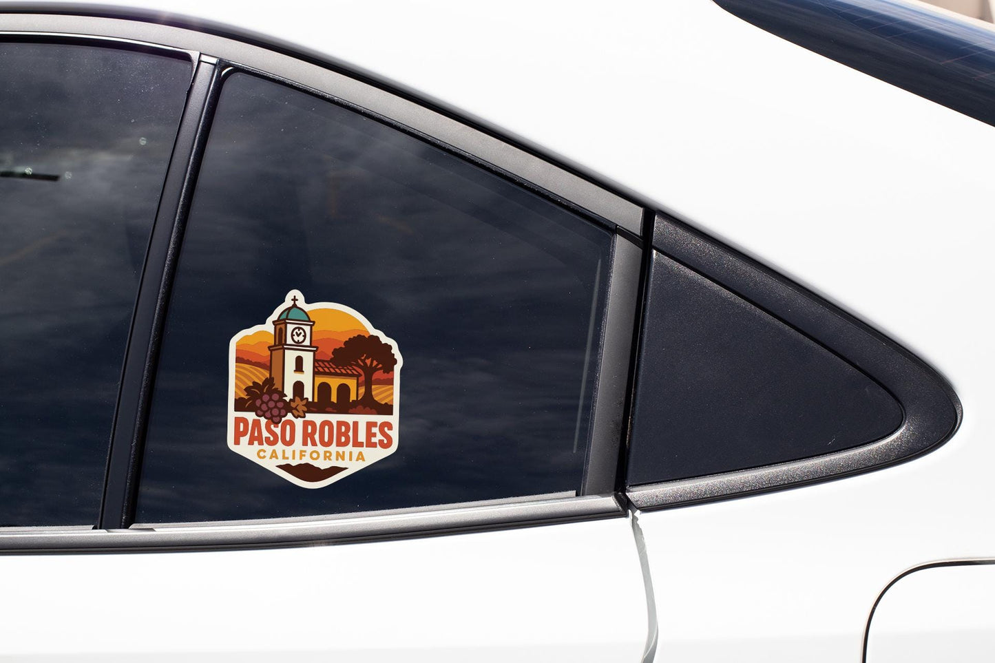 A sticker on the side of a car window, featuring a graphic of a building and the text "PASO ROBLES CALIFORNIA".