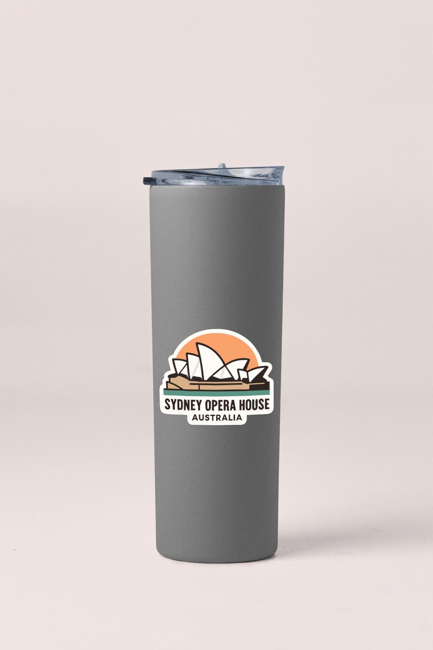 A gray insulated tumbler with a sticker featuring the Sydney Opera House logo.