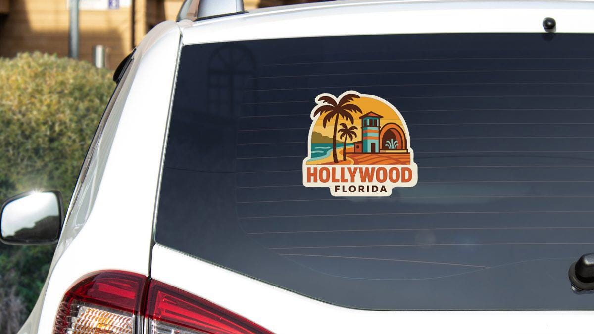 A sticker on the rear window of a white car, depicting a tropical beach scene with palm trees and a building, representing Hollywood, Florida.
