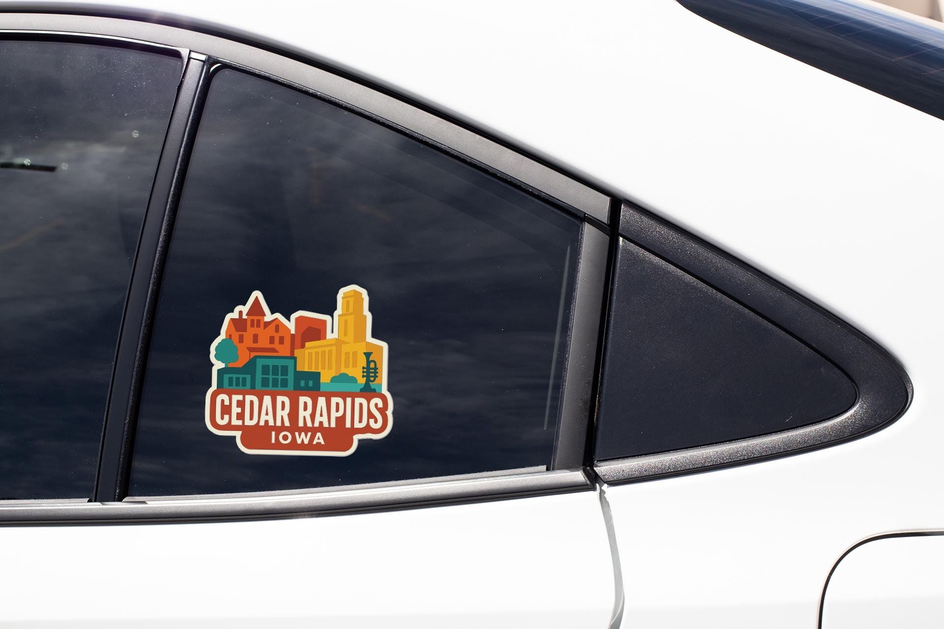 A car window sticker on a vehicle, displaying the text "Cedar Rapids, Iowa".