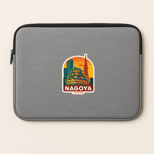 A gray laptop sleeve with a colorful sticker of the Nagoya Tower and the text "Nagoya Japan" printed on it.