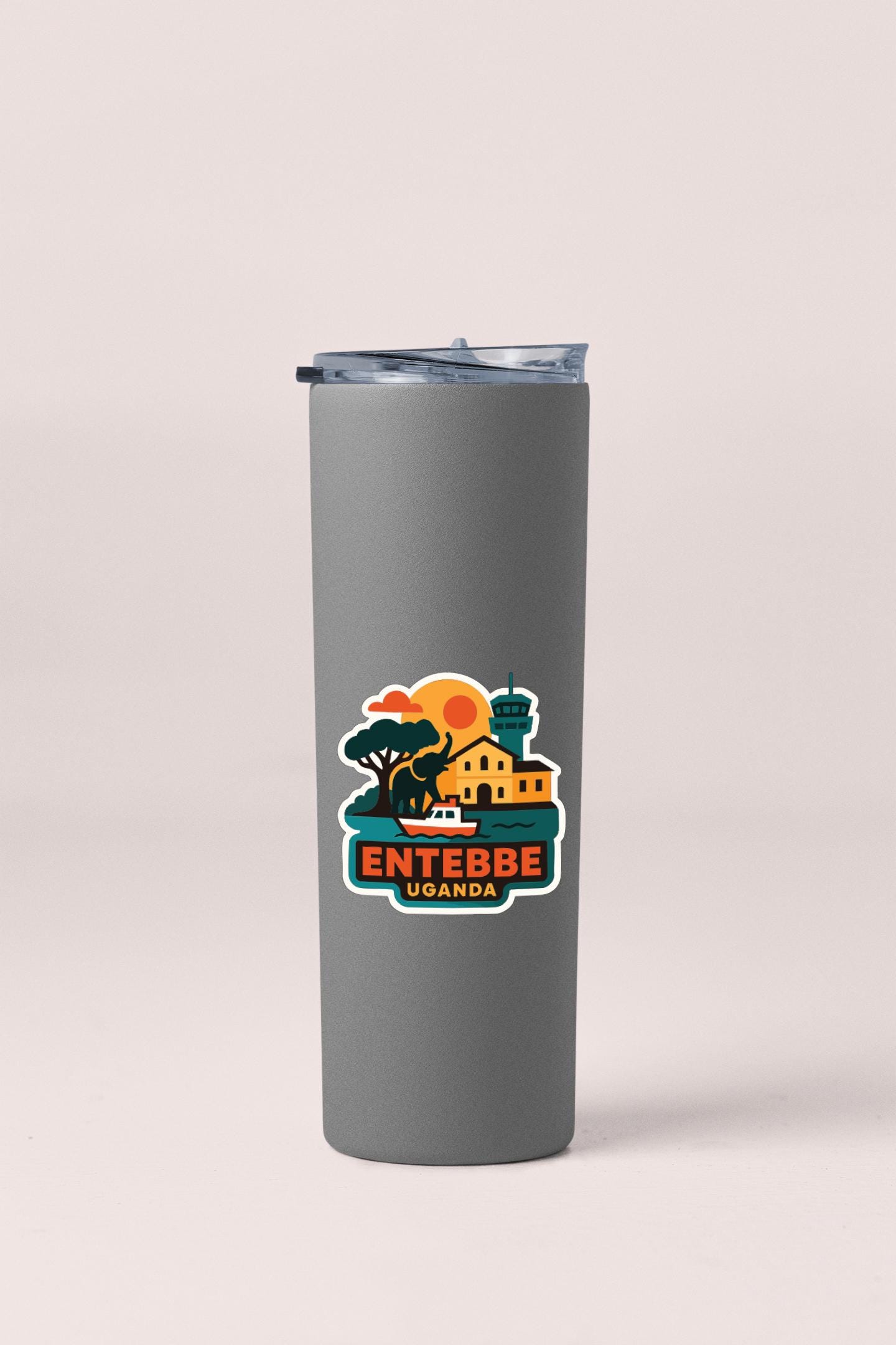 A gray insulated tumbler with a colorful graphic design depicting a tropical island scene.