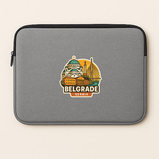 a gray laptop sleeve with a sticker depicting the city of Belgrade, Serbia.