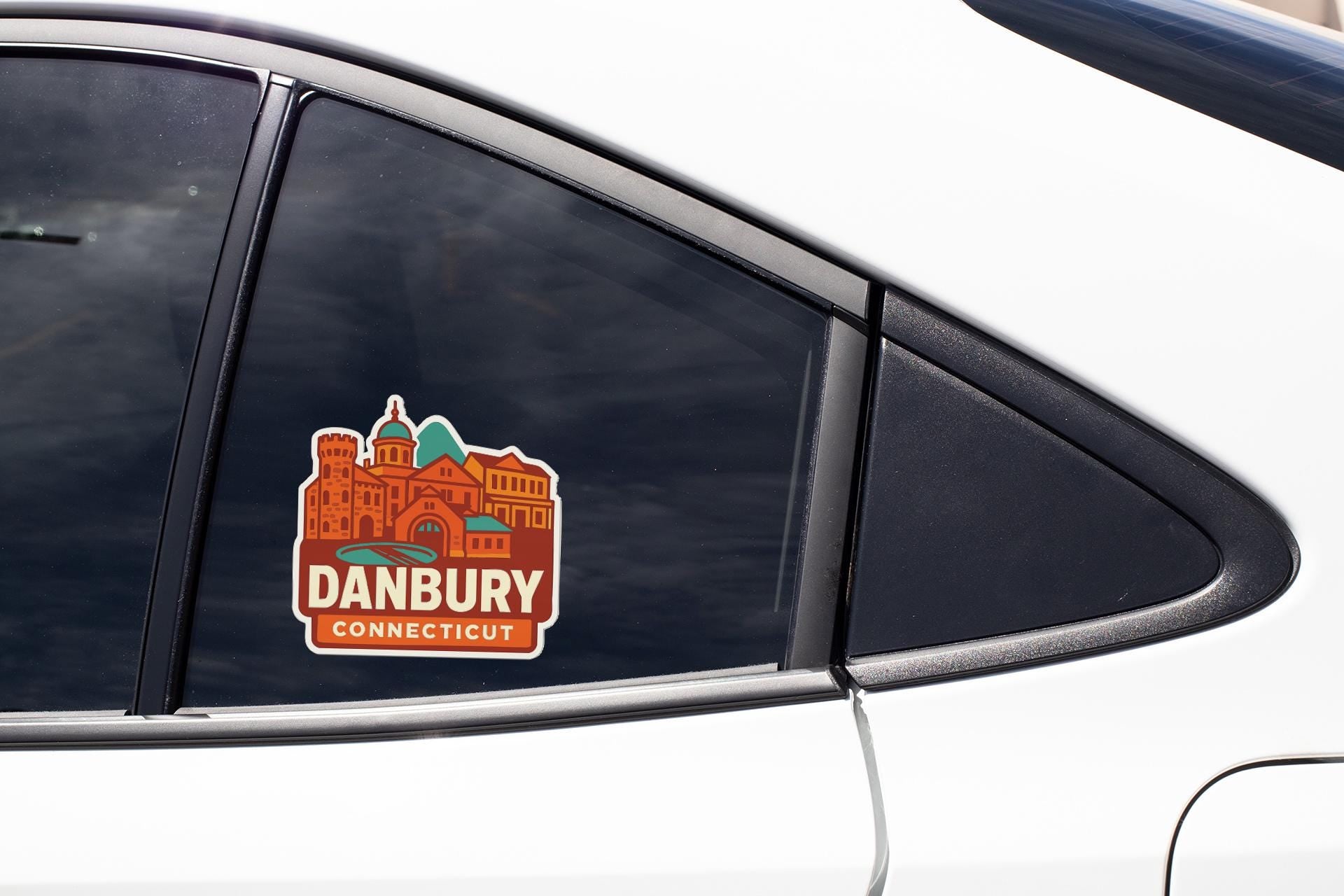 A sticker on the side of a car window that says "DANBURY CONNECTICUT".