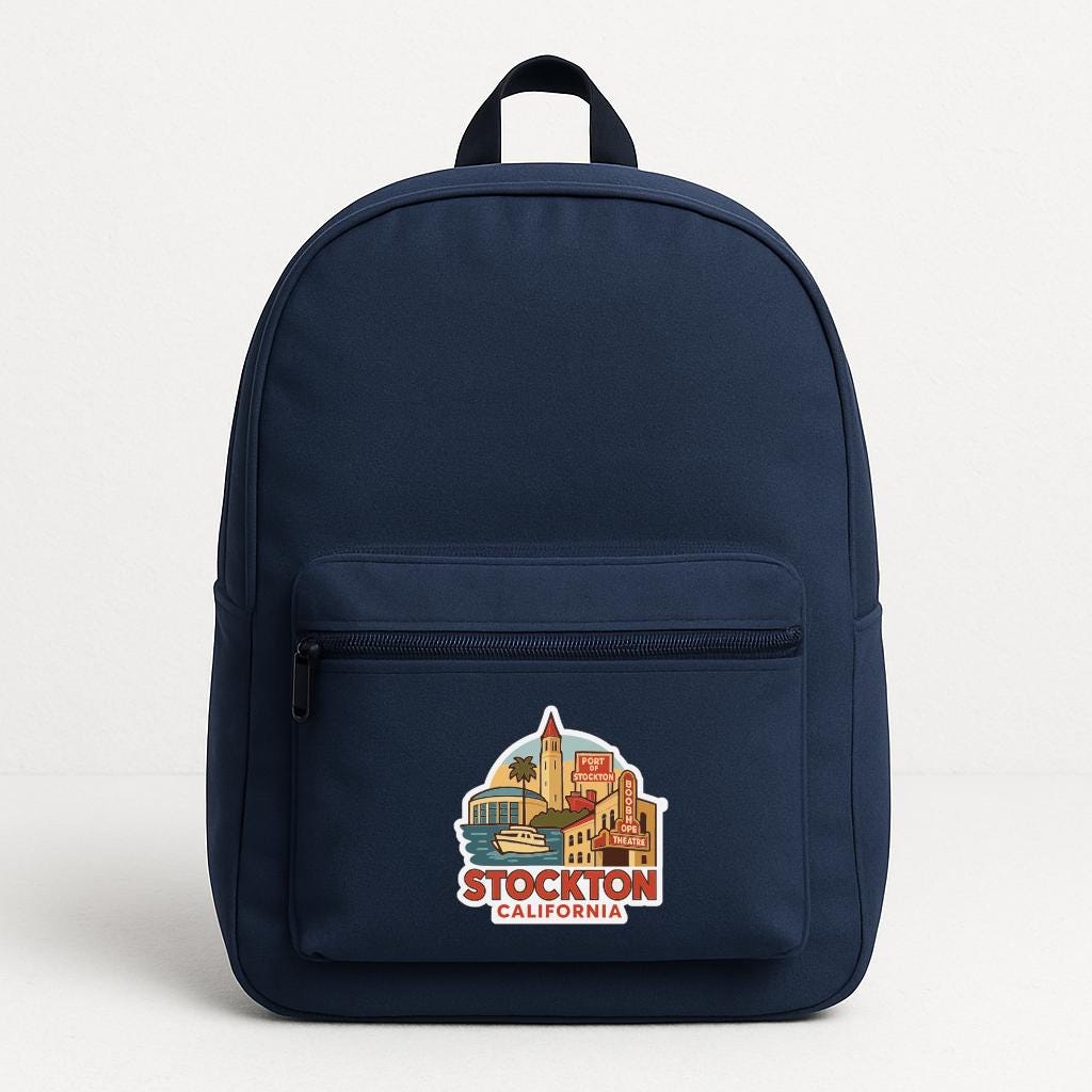 A navy blue backpack with a sticker on the front that says "STOCKTON CALIFORNIA".