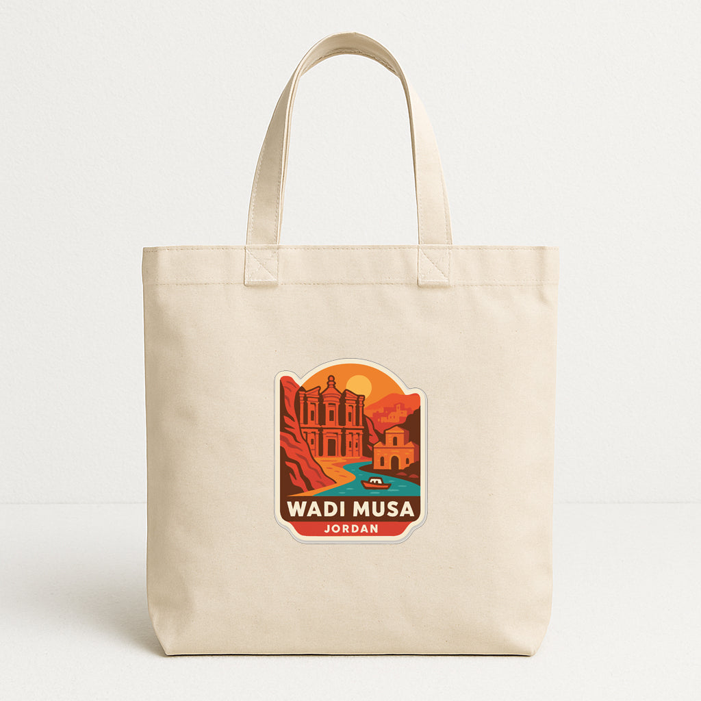 A beige tote bag with a printed design depicting a desert landscape with a building and a river.