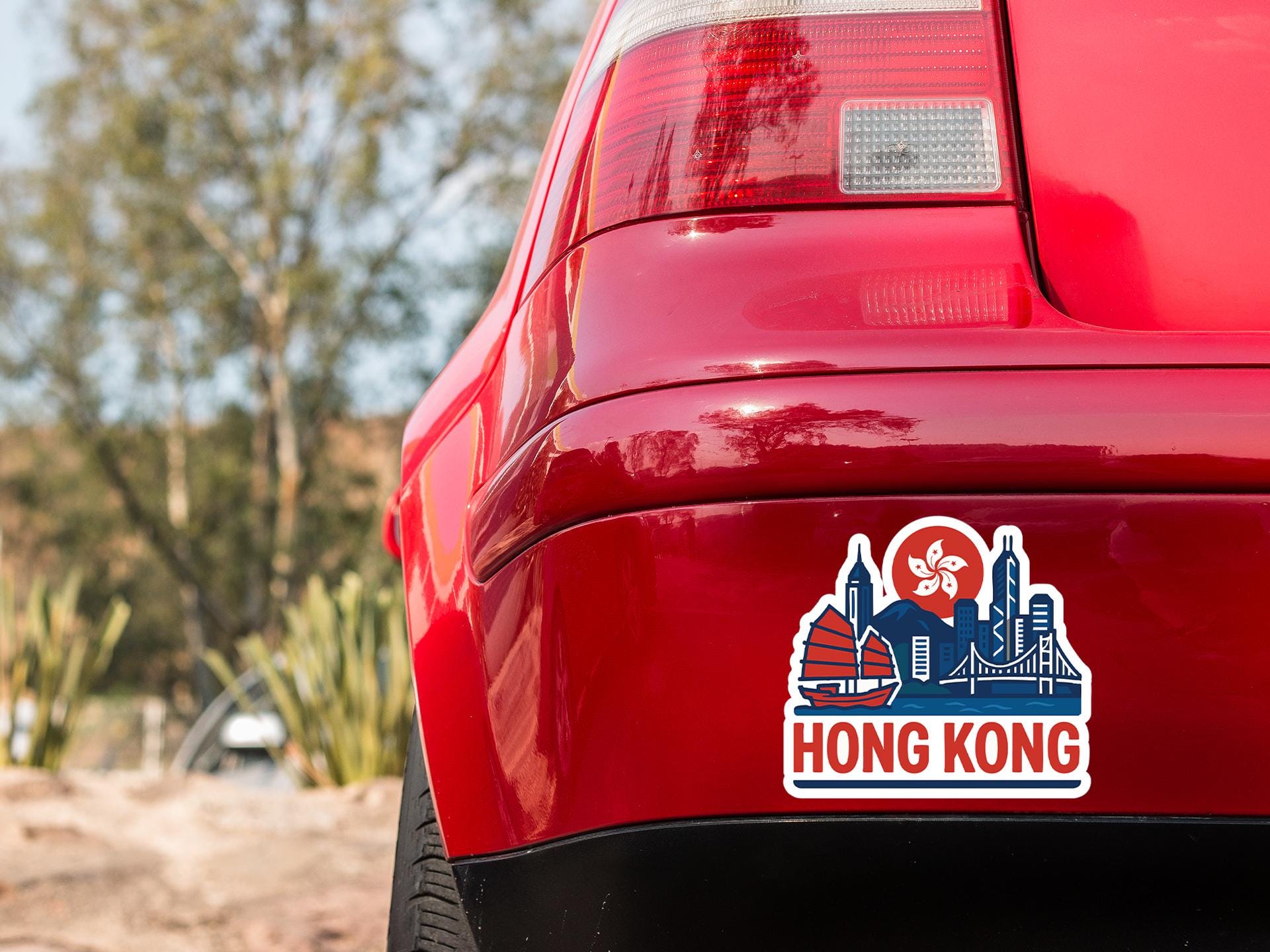 a red car with a sticker on it