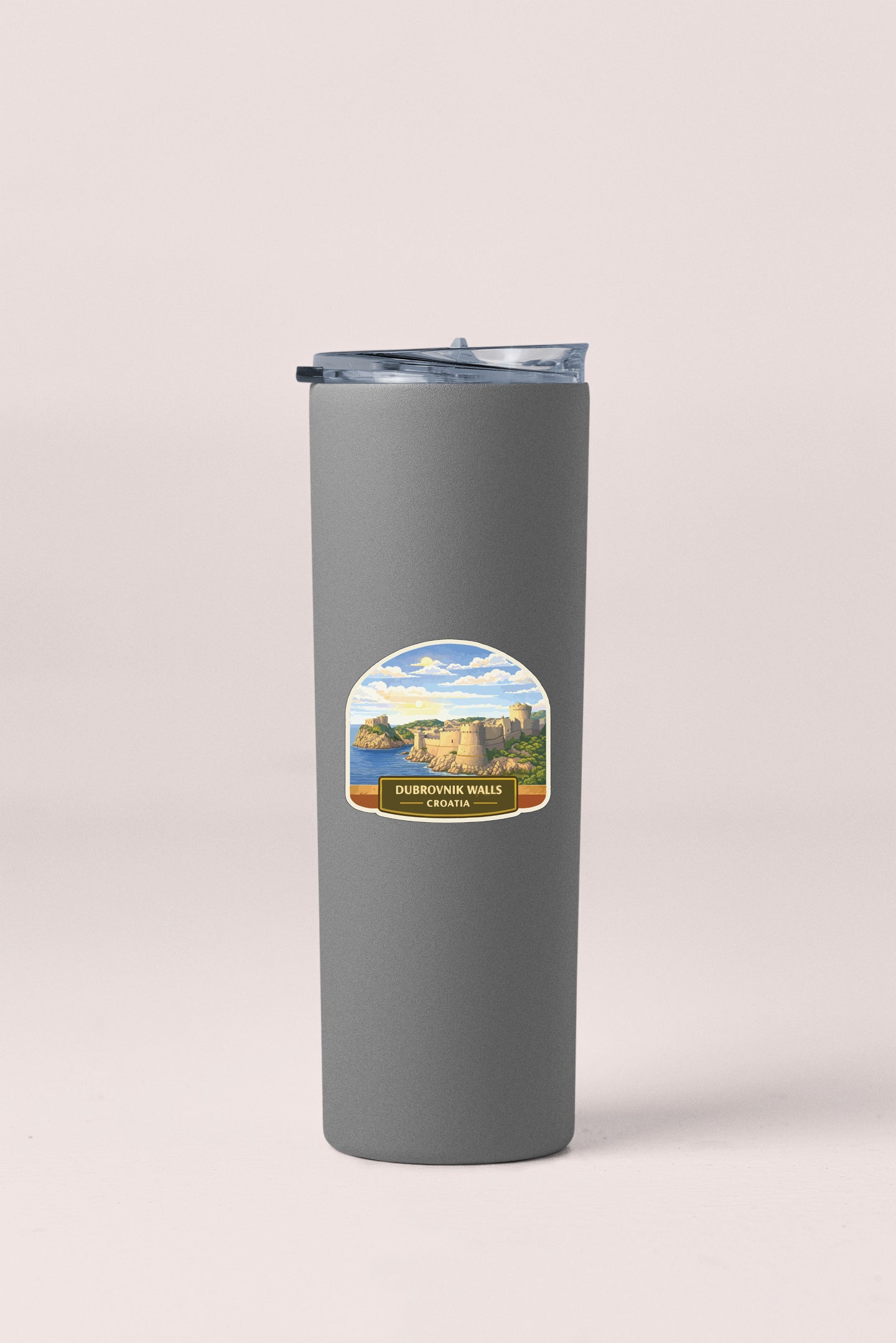 A gray insulated tumbler with a label that says "DUBOVNA WALLS, CROZIA".