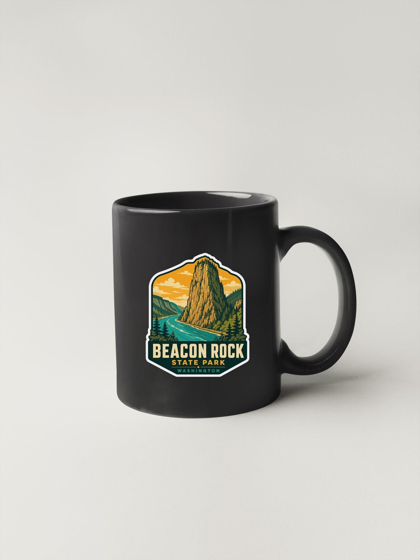 A black coffee mug with a graphic design depicting a mountain landscape and the text "BEACON ROCK STATE PARK WASHINGTON, D.C."