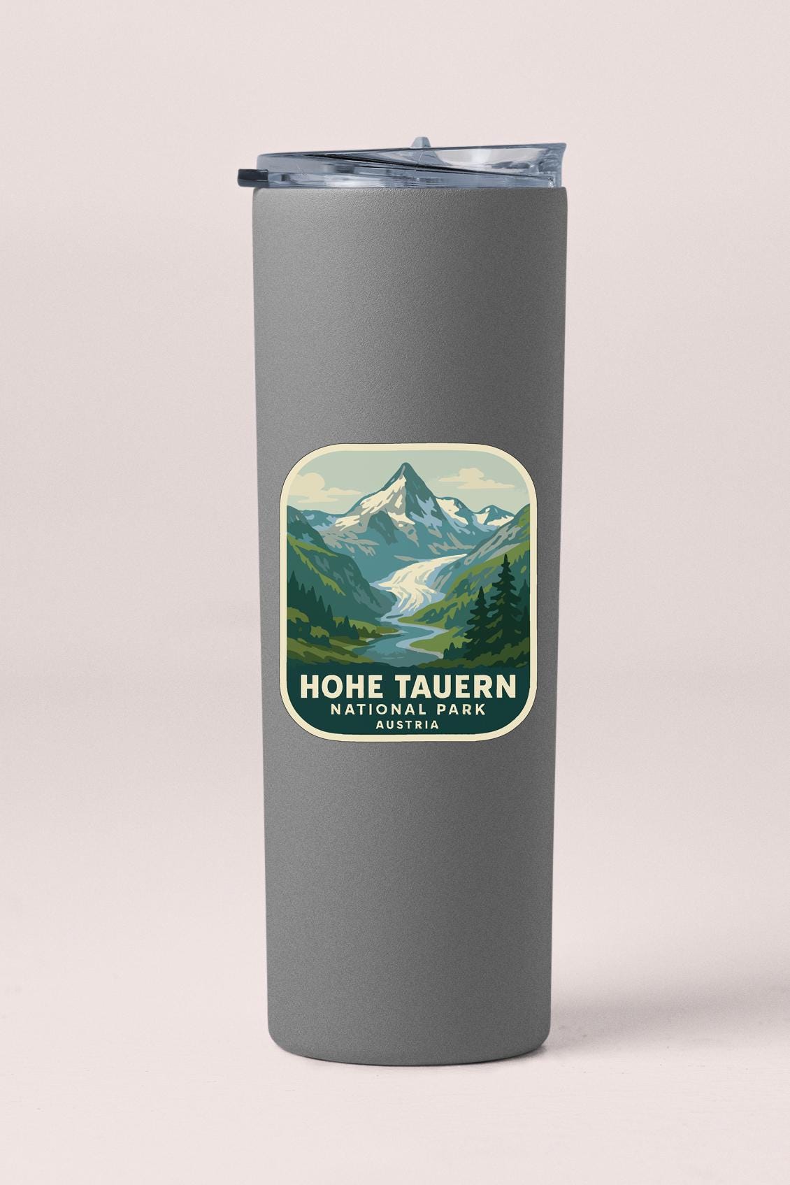 A gray insulated tumbler with a label that says "Hoehe Taunern National Park, Austria".