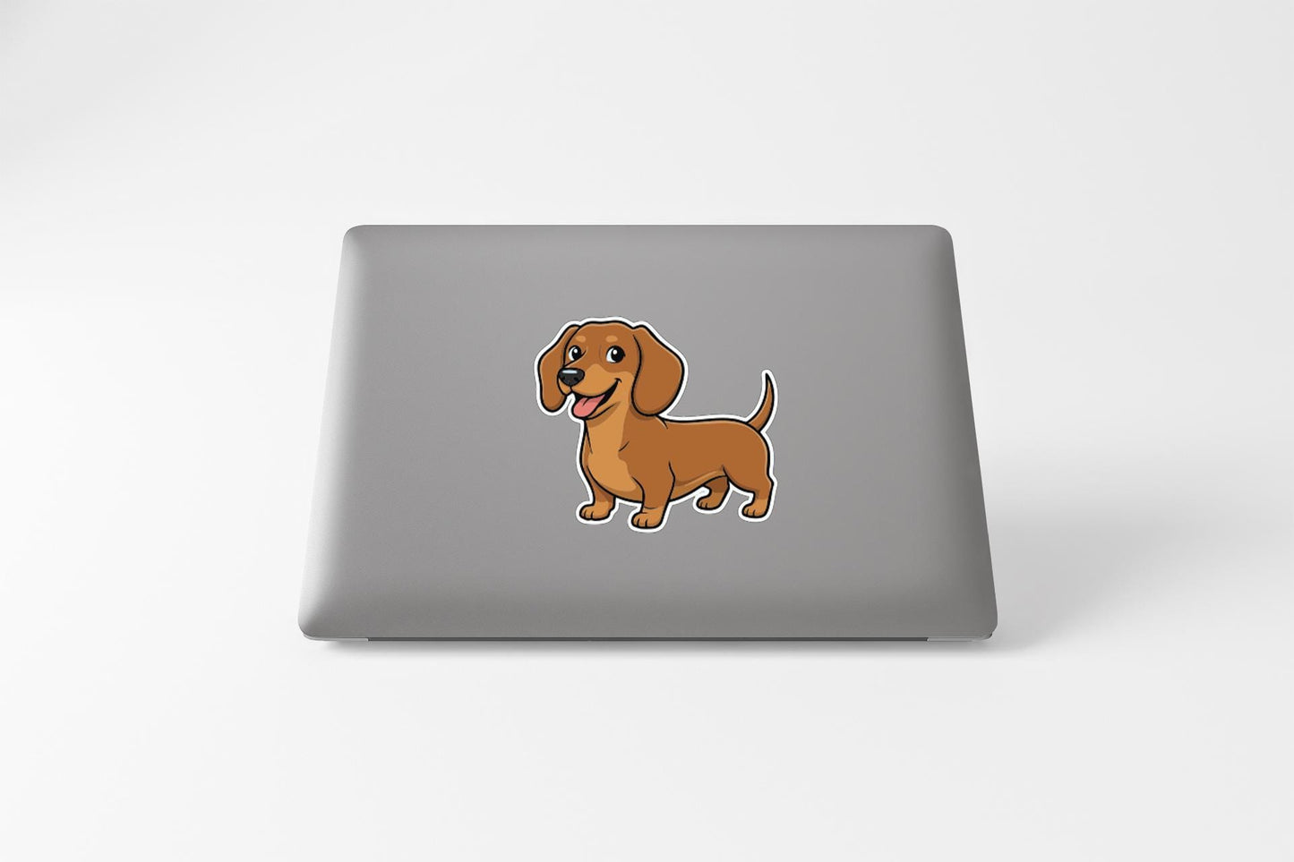 A cartoon illustration of a brown dachshund dog on a laptop.
