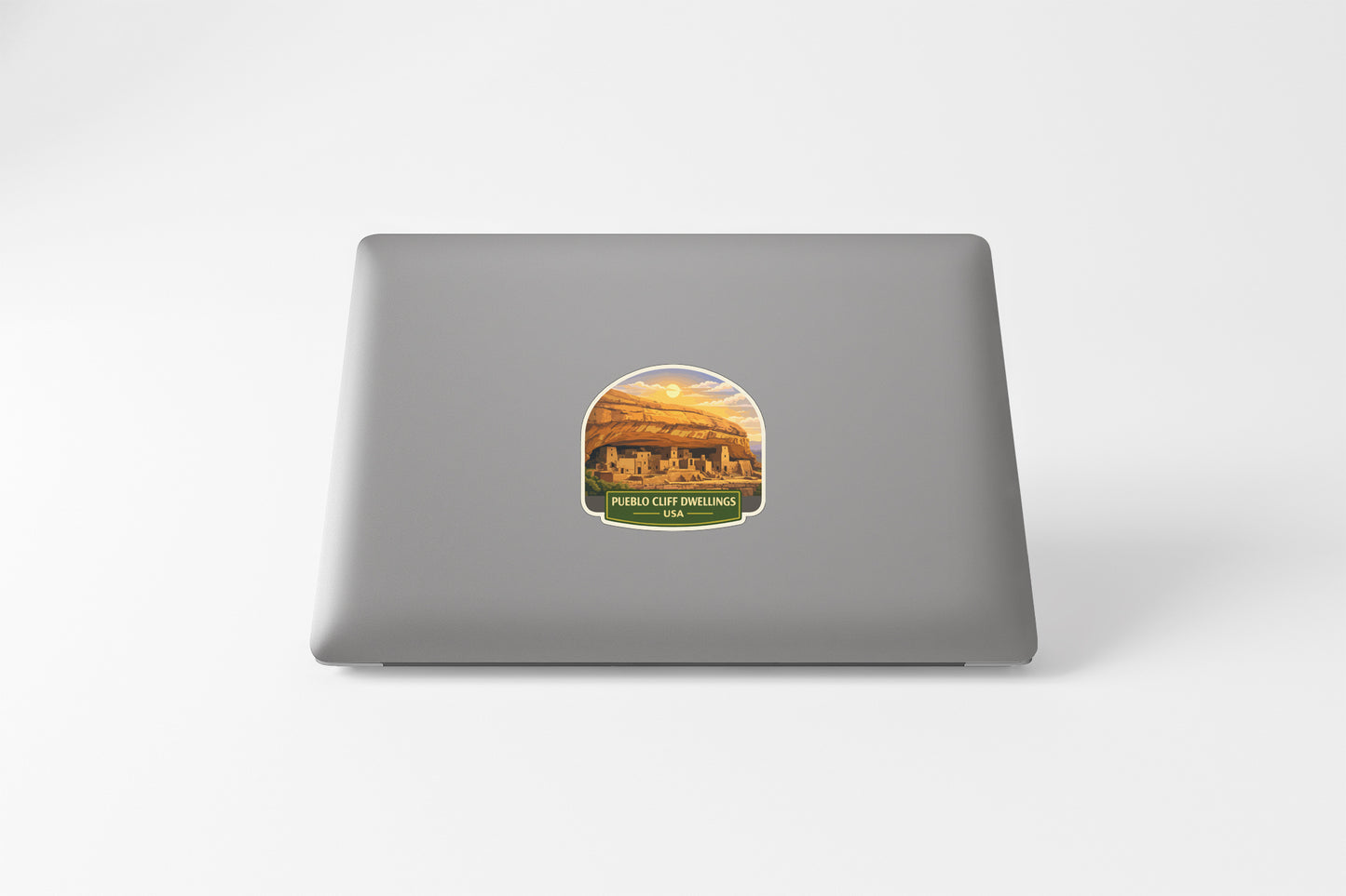 a sticker with a scenic landscape on a laptop.