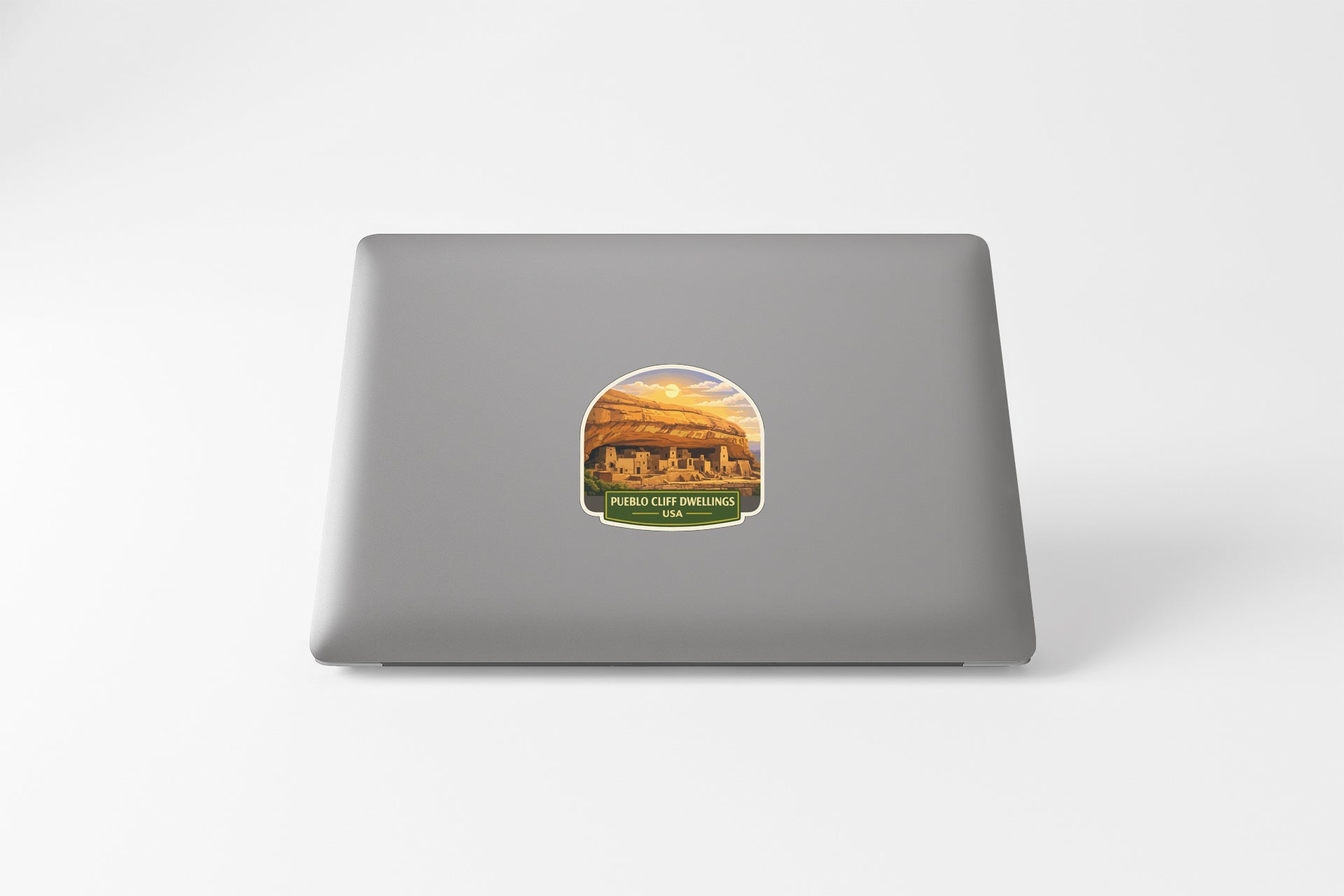 a sticker with a scenic landscape on a laptop.