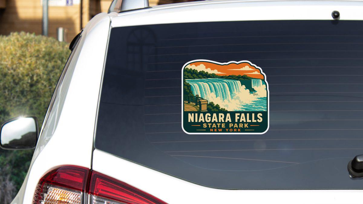 A sticker on the rear window of a car that says " Niagara Falls State Park New York".