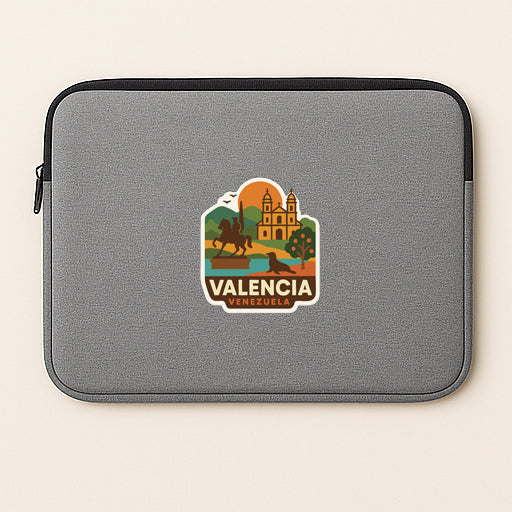 a gray laptop sleeve with a sticker depicting a scenic view of ValENCIA, Spain.