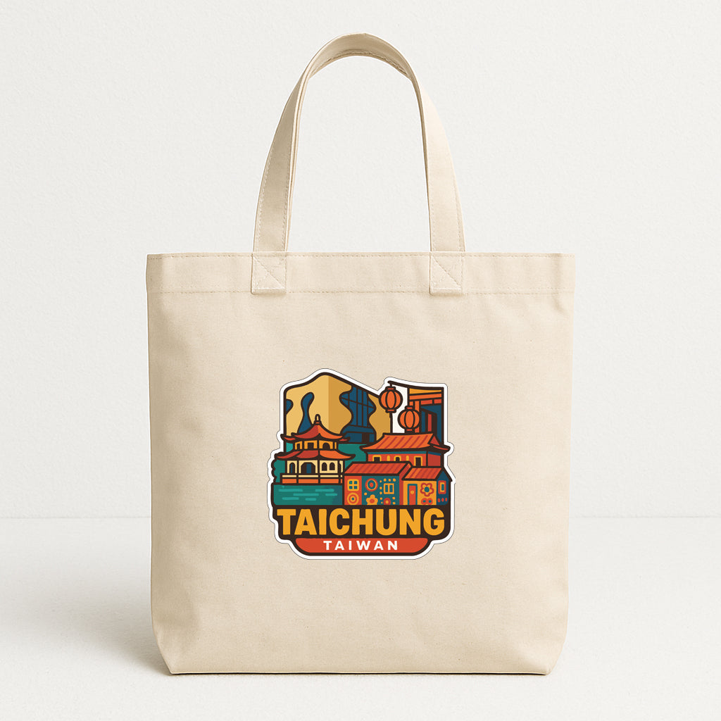 A beige tote bag with a colorful graphic of a cityscape and the text "TAICHUNG TAIWAN" printed on it.