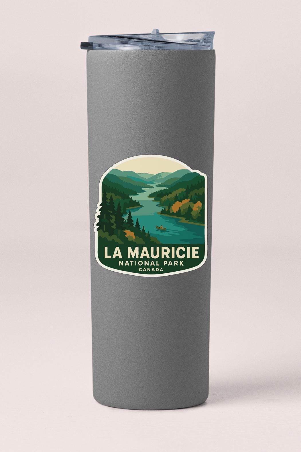 A gray cylindrical container with a label that says "LA MAURICIE NATIONAL PARK CANADA".