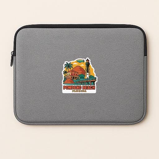 A gray laptop sleeve with a sticker depicting a lighthouse and a beach scene.