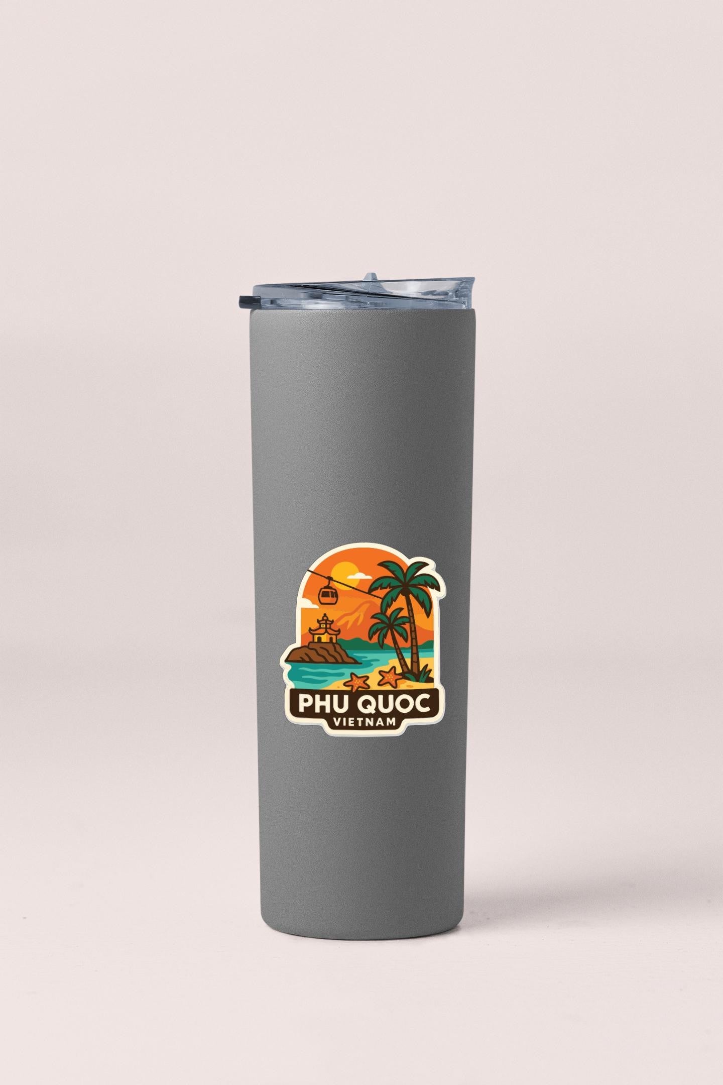 A gray insulated tumbler with a sticker depicting a tropical beach scene and the text "PHU QUOC VIETNAM" printed on it.