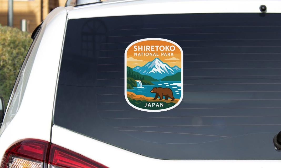A sticker on the rear window of a car that says "SHIRETOKO NATIONAL PARK JAPAN".