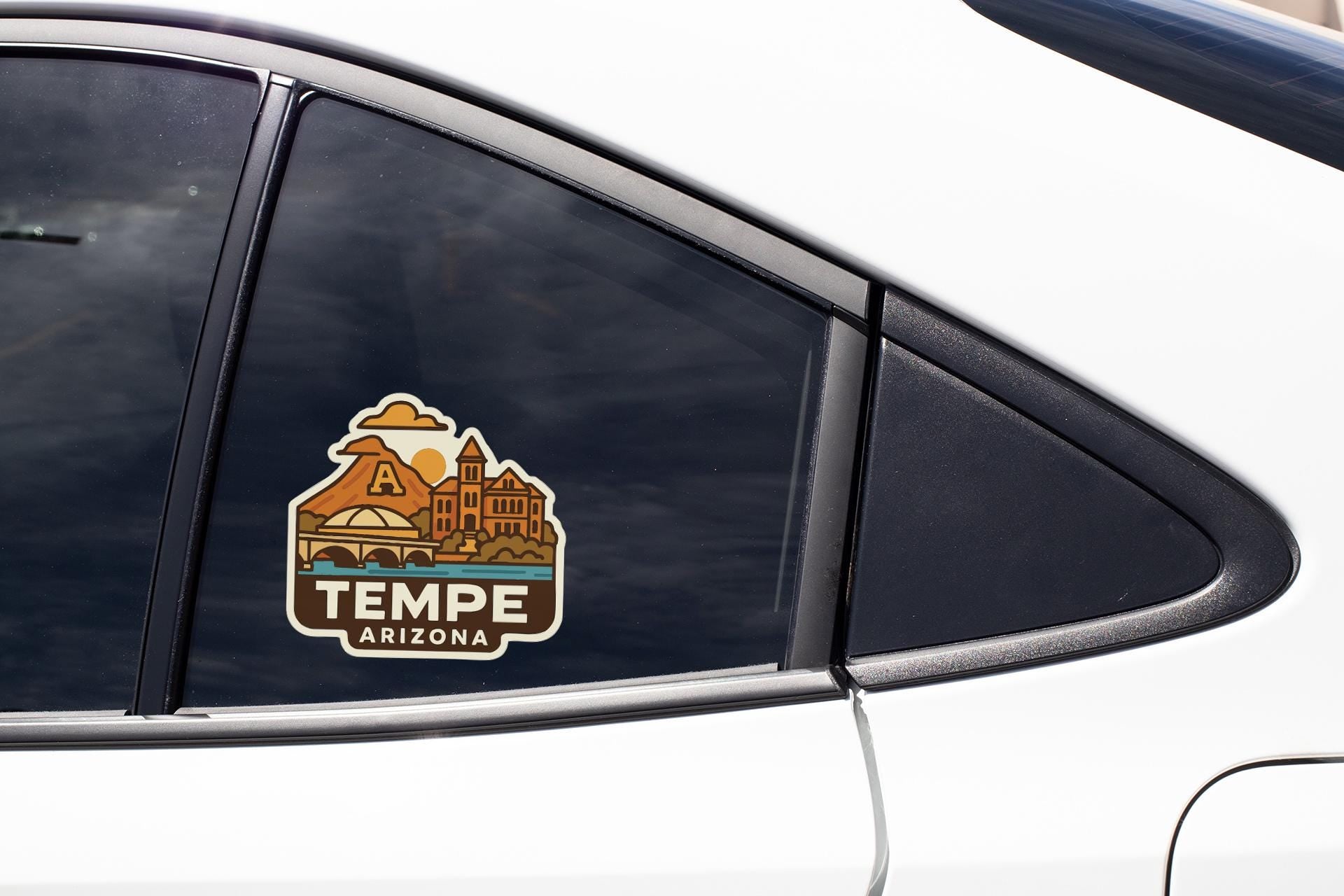 A sticker on the side of a car window that says "TEMPE ARIZONA".