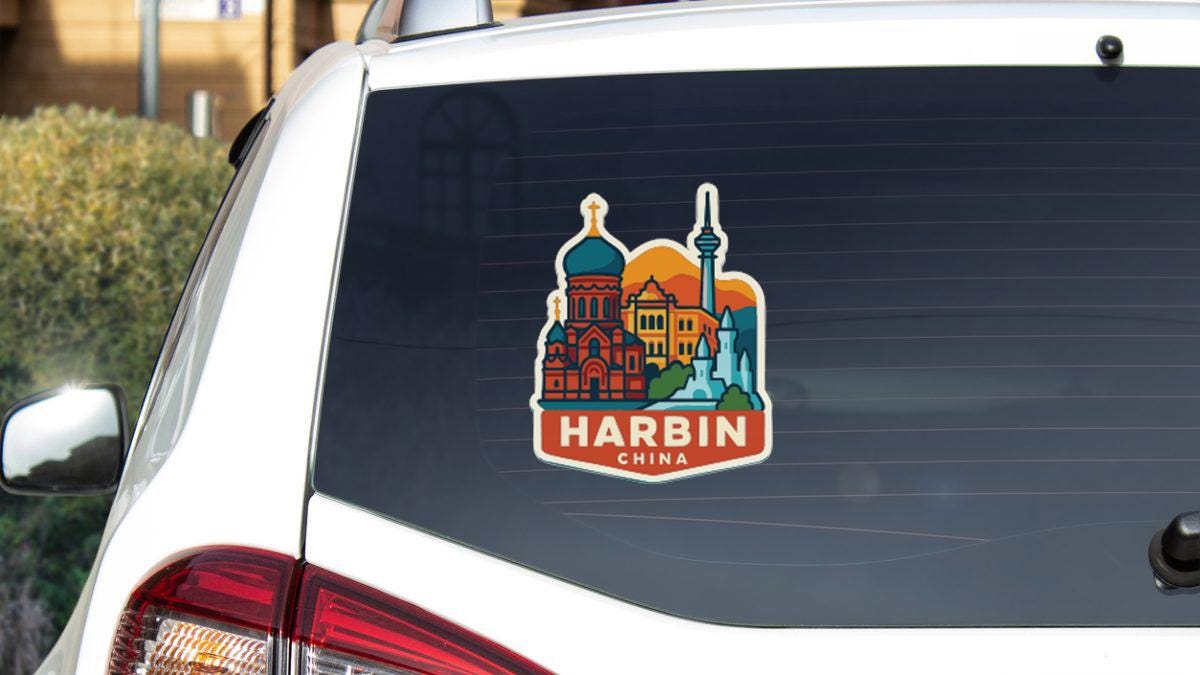 A sticker on the rear window of a car that features a colorful illustration of Harbin, China.