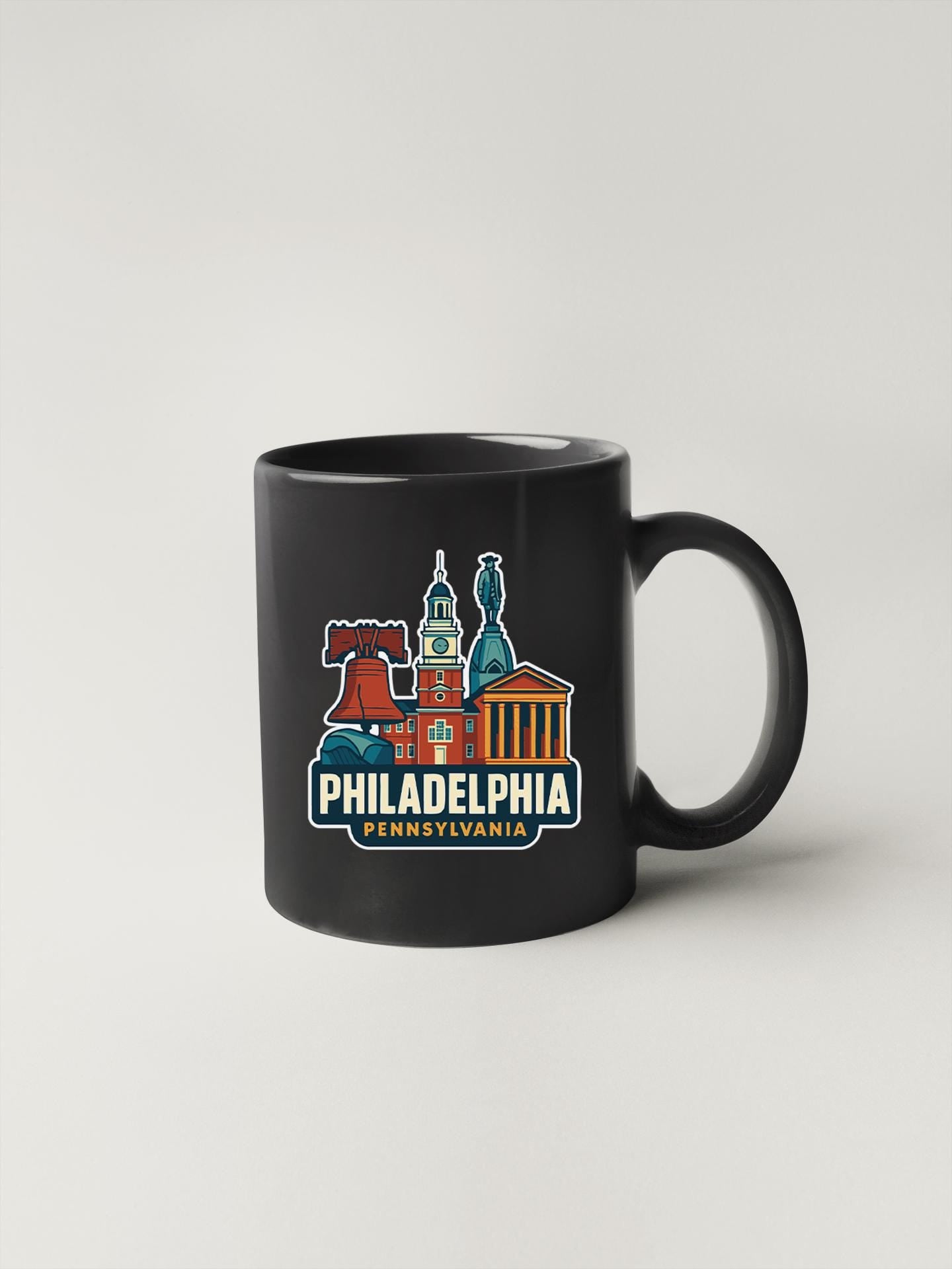 a black coffee mug with philadelphia on it