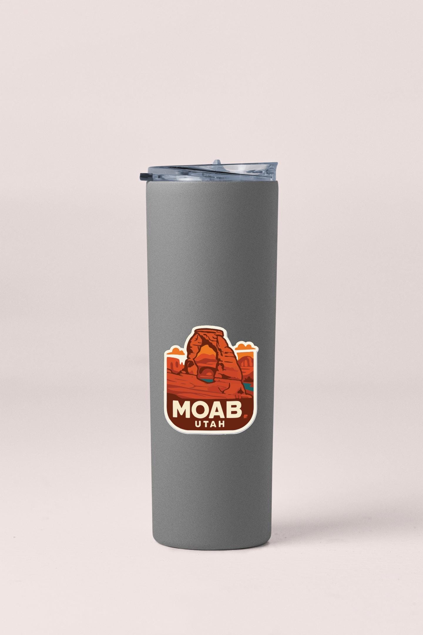 A gray insulated tumbler with a Moab Utah logo printed on it.