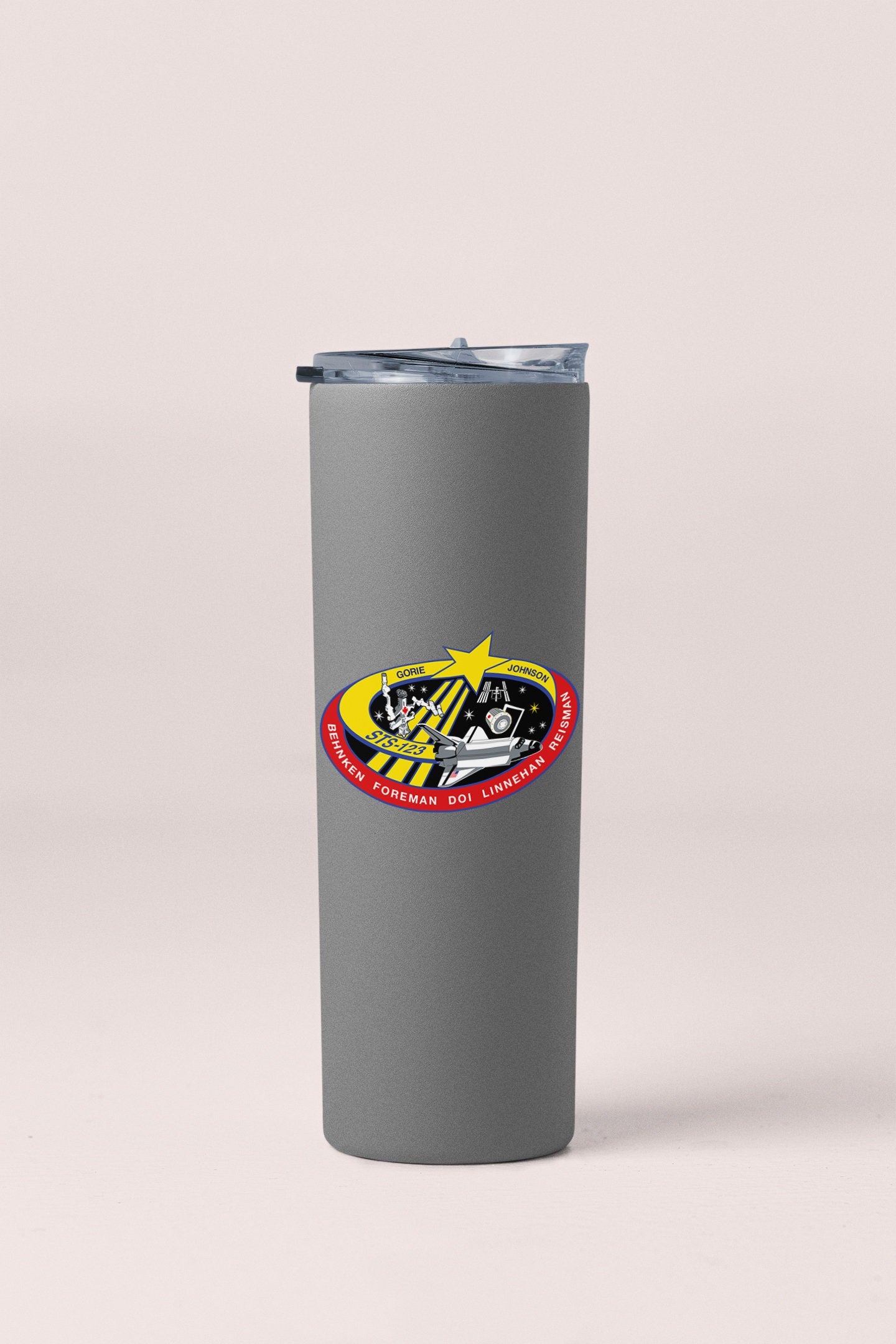 a stainless steel tumbler with a picture of a motorcycle on it