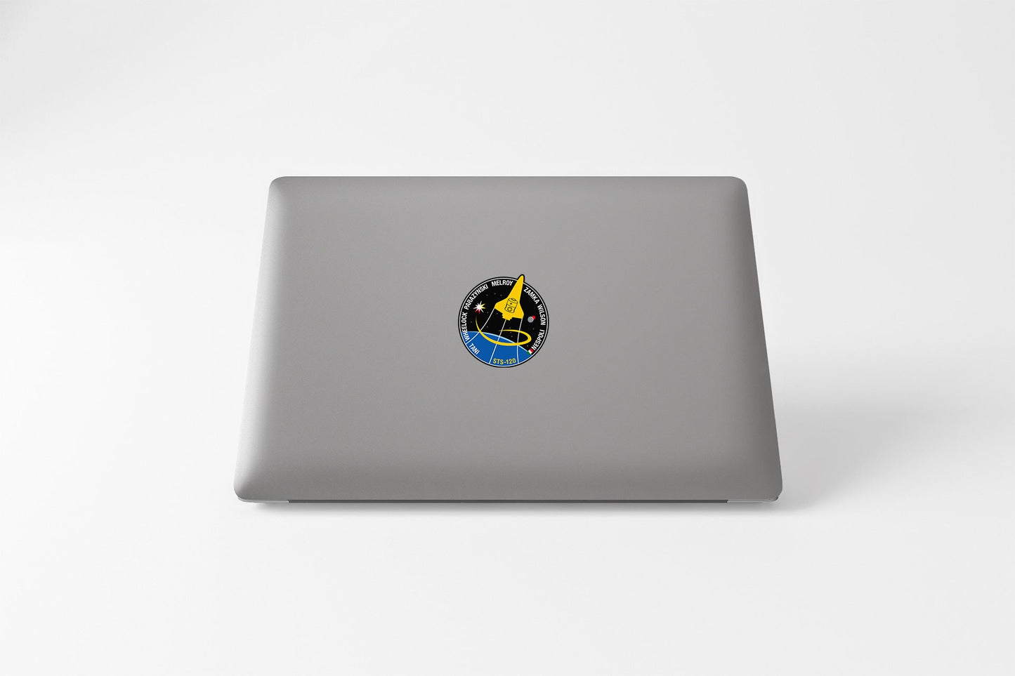 a laptop with a sticker of a bird on it