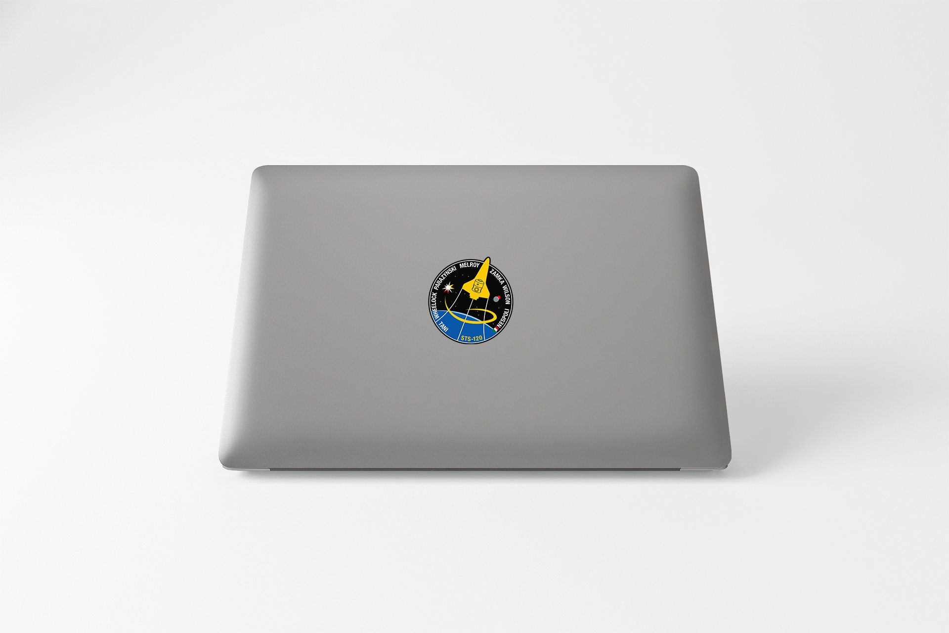 a laptop with a sticker of a bird on it