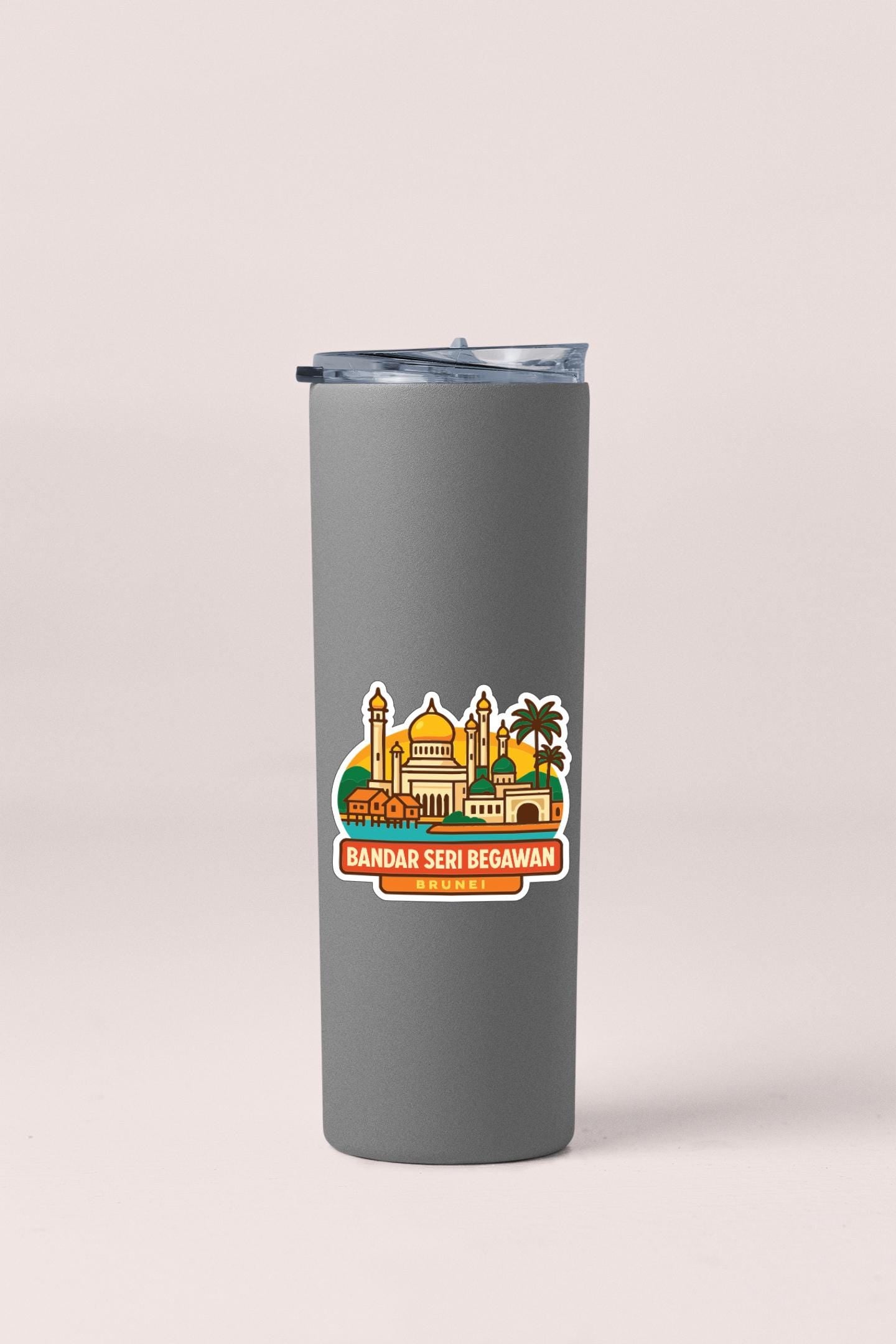 A gray insulated tumbler with a sticker depicting a city skyline and the text "BANDAR SERI BEGAWAN BRUNEI".