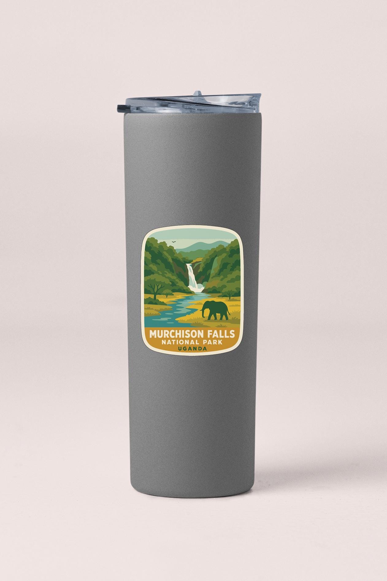 A gray insulated tumbler with a label depicting a scenic landscape featuring a waterfall and an elephant.