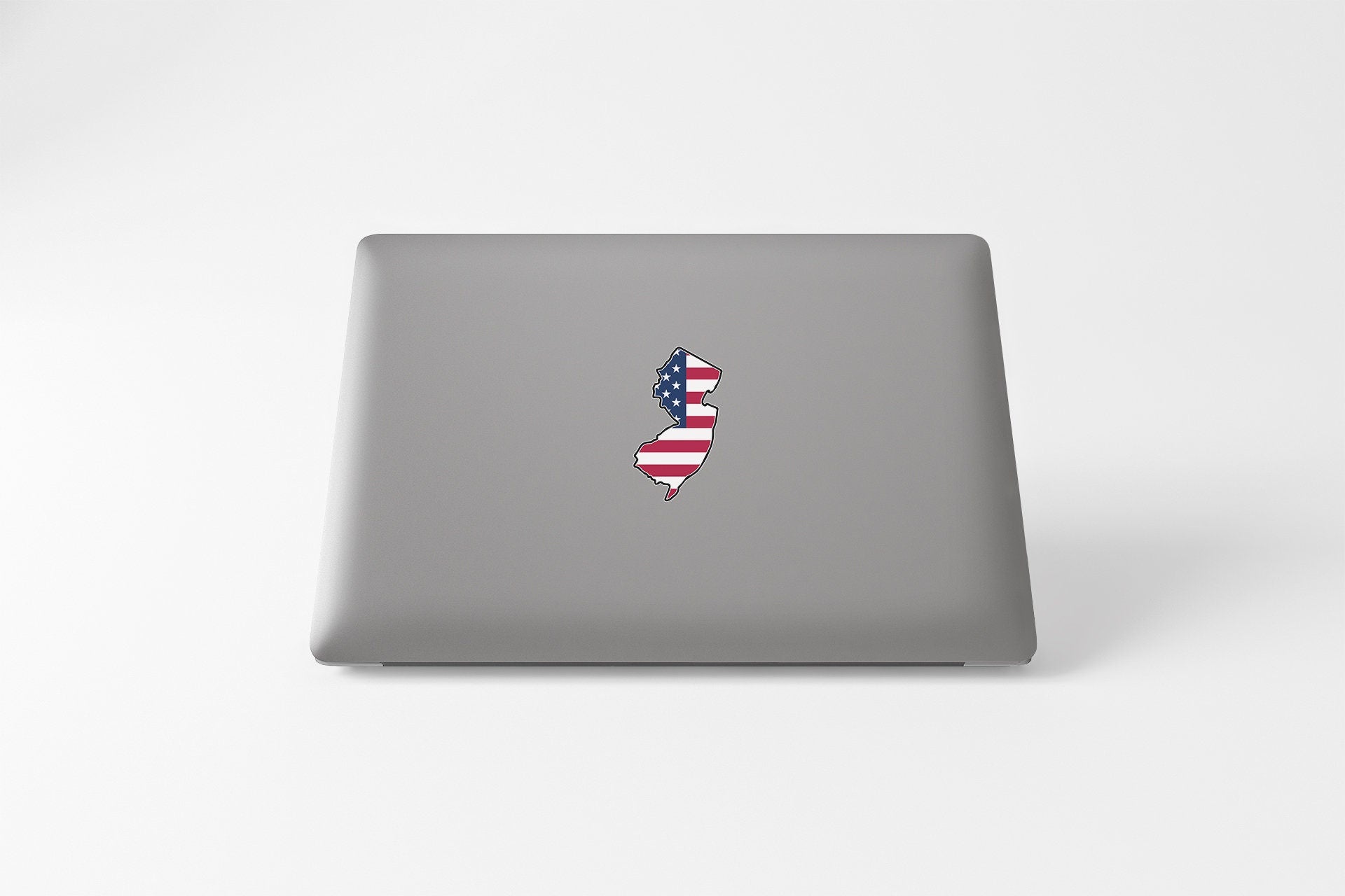a laptop with a sticker of a map of the united states