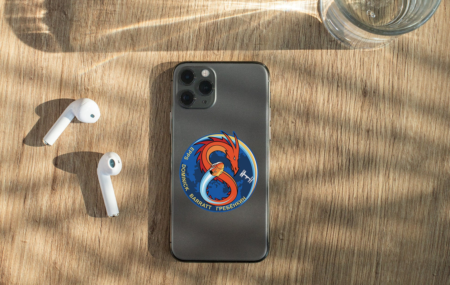 a phone and ear buds sitting on a table