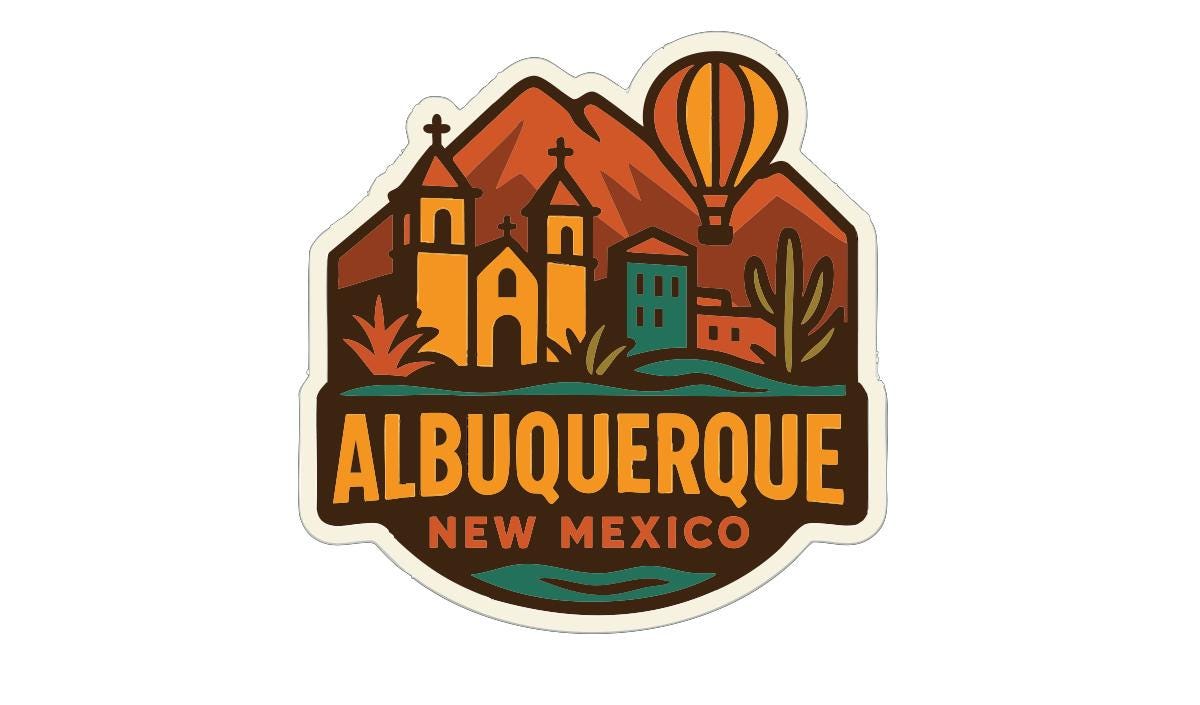 a sticker or emblem with a stylized representation of the city of Albuquerque, New Mexico, including mountains, buildings, and a hot air balloon.