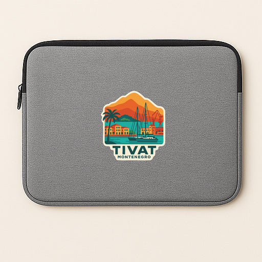 A gray laptop sleeve with a colorful graphic of a tropical island and a sailboat.