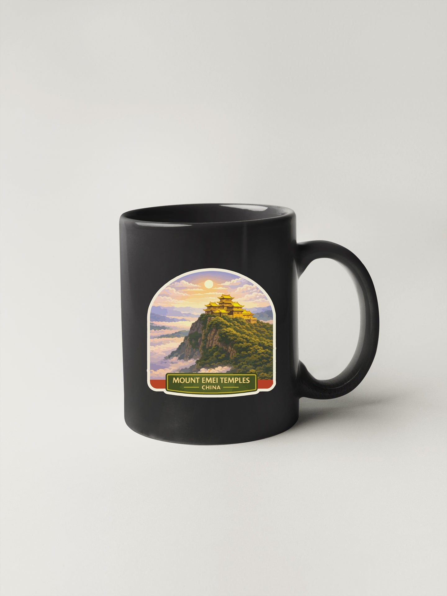 A black coffee mug with a printed image of Mount Emei Temple in Tibet.