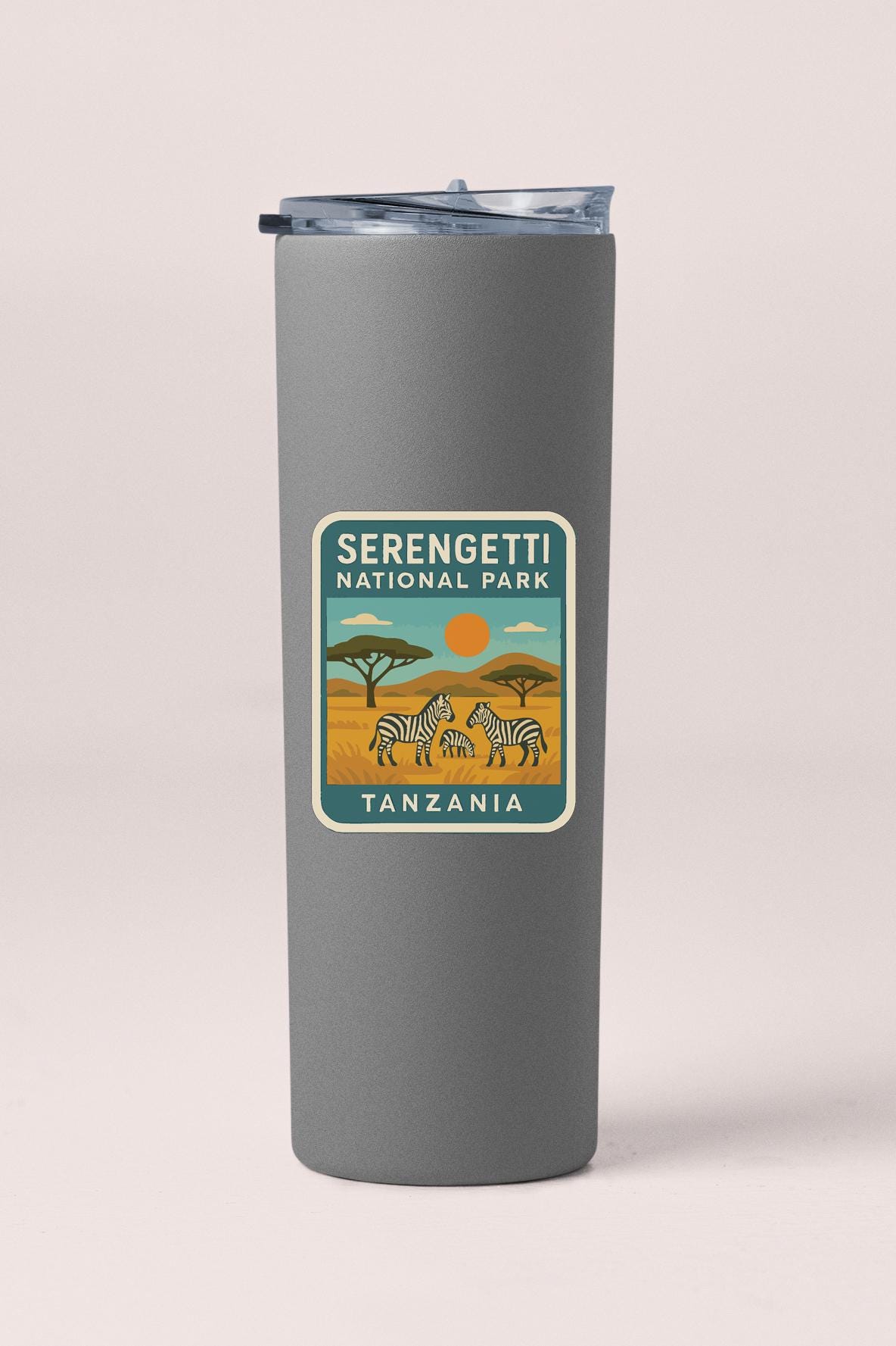 A gray insulated tumbler with a label that says "Serengeti National Park Tanzania".