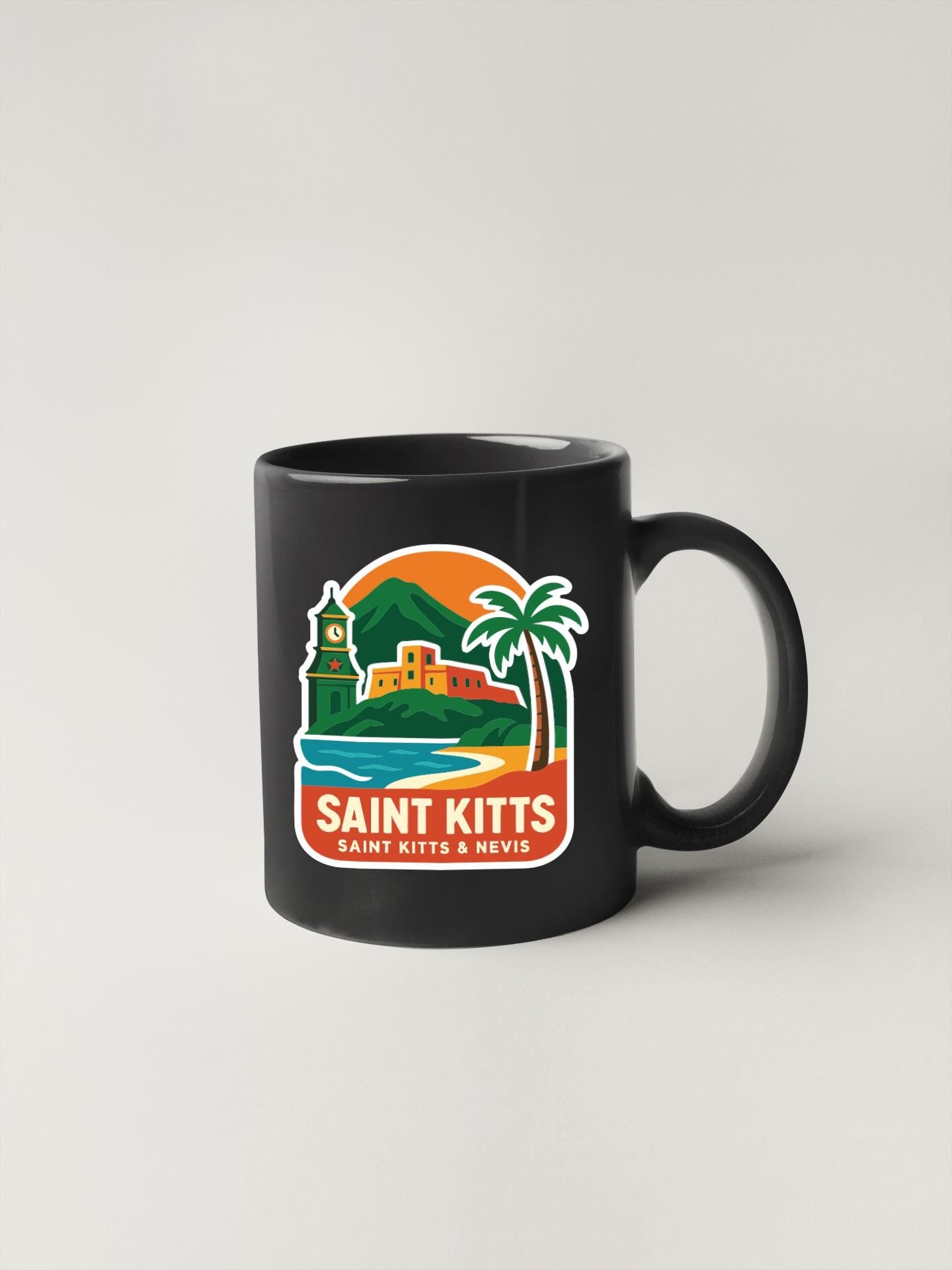 A black coffee mug with a colorful graphic design depicting a tropical island landscape, including a lighthouse, palm trees, and a castle.