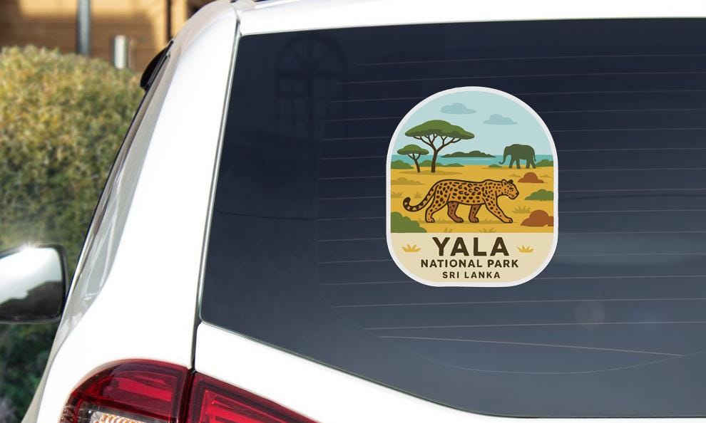 A sticker on the rear window of a car, depicting a leopard and the text "YALA NATIONAL PARK SRI LANKA".